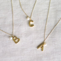 THE INITIAL NECKLACE